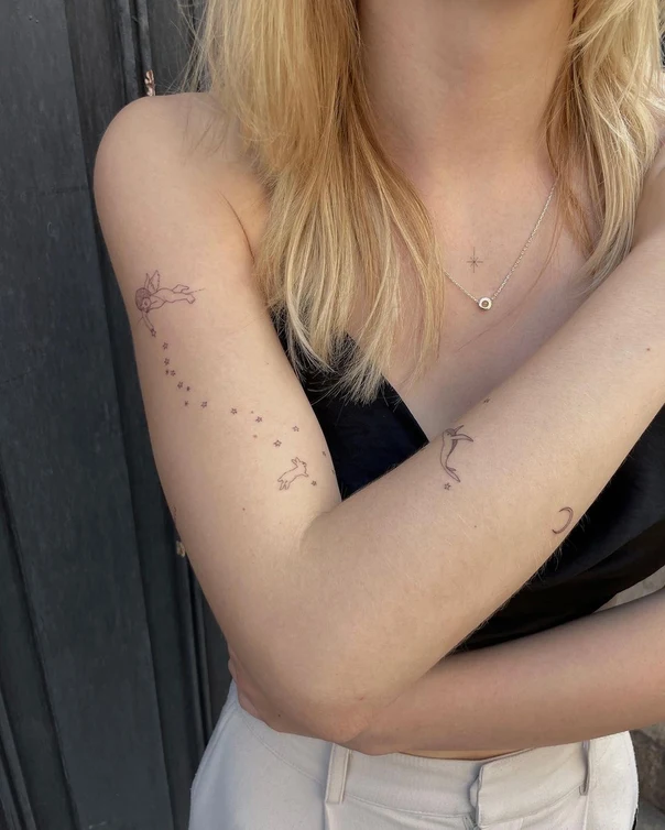 Fineline Stars, Angel tattoo on Forearm