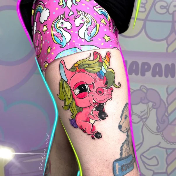 Cartoon Unicorn tattoo on Thigh