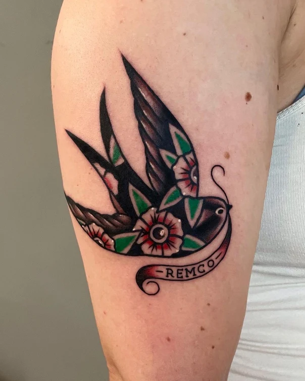 Traditional Bird, Flowers tattoo on Upper Arm