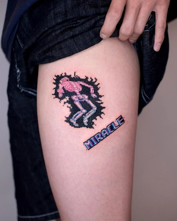 Pixel Skeleton, Text tattoo on Thigh