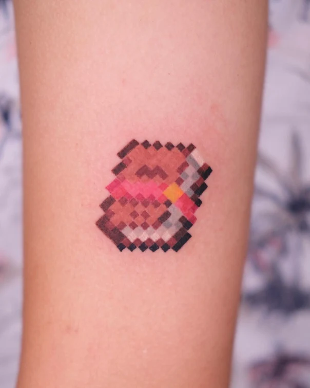 Pixel Book tattoo on Forearm
