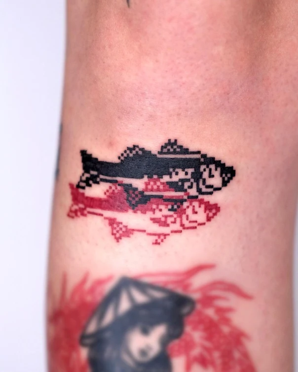 Pixel Fish tattoo on Forearm
