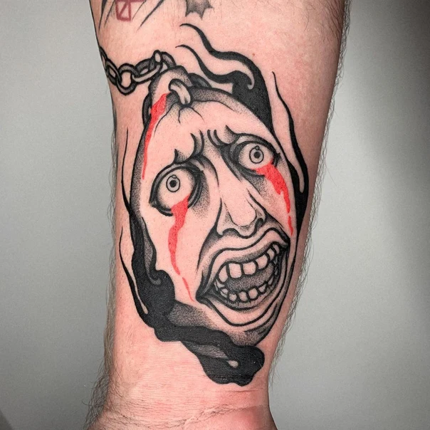 Traditional Face, Chain tattoo on Forearm