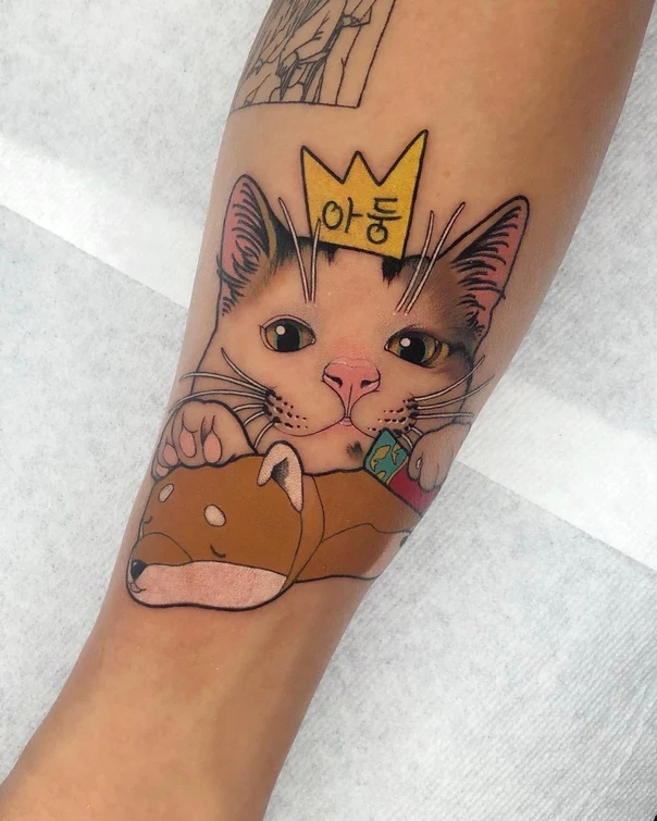 Cartoon Cat, Dog tattoo on Forearm