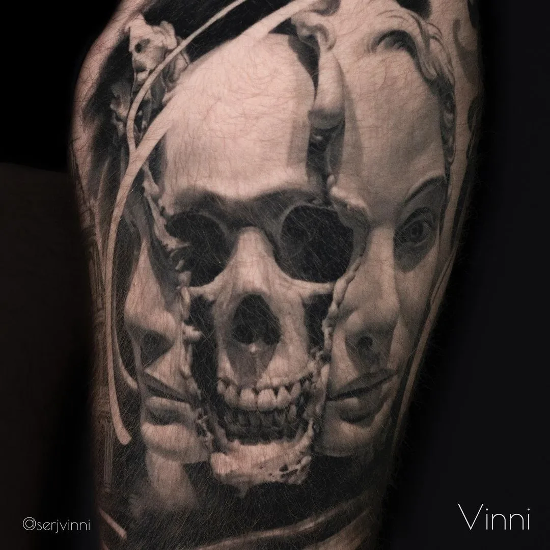 A hyperrealistic black and grey tattoo featuring a skull merging with human faces in a surreal, detailed composition.