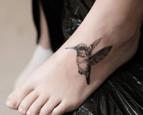 Realism Hummingbird tattoo on Foot