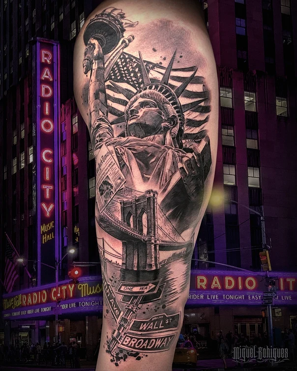 Black & Grey Statue of liberty, American flag tattoo on Thigh