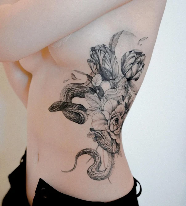 Black & Grey Snake, Flowers tattoo on Ribcage