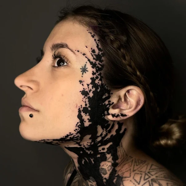 Blackwork Star tattoo on Face