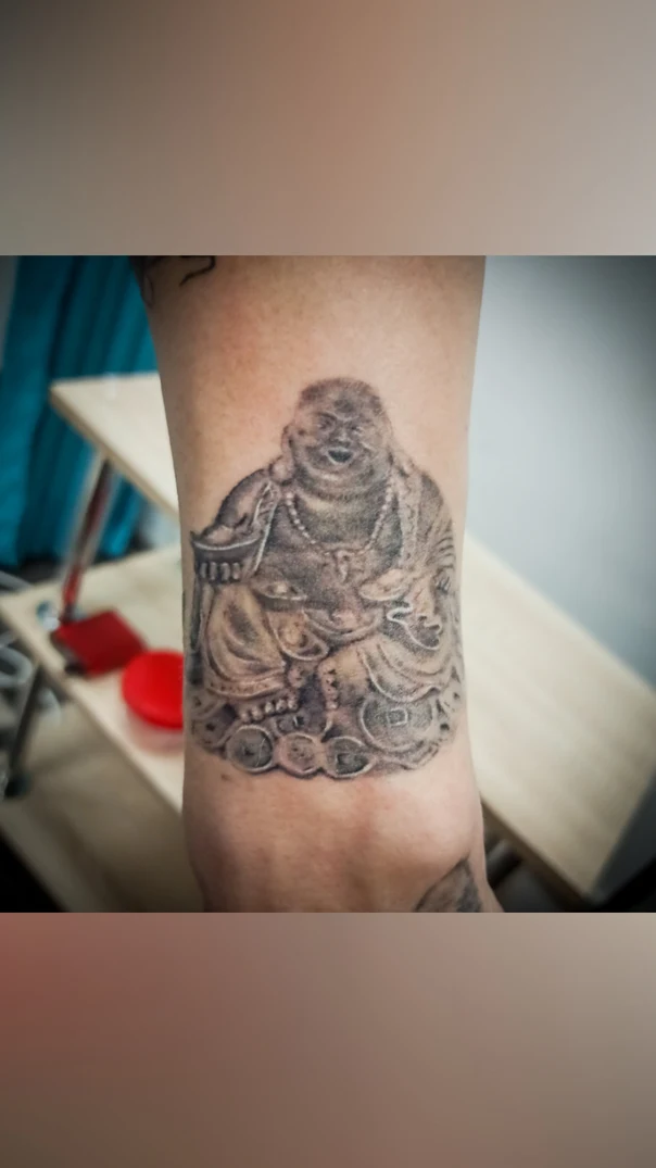 Black & Grey Buddha tattoo on Forearm