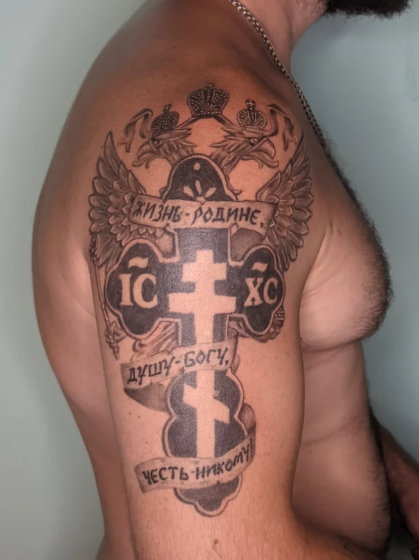 Blackwork Cross, Wings tattoo on Upper Arm