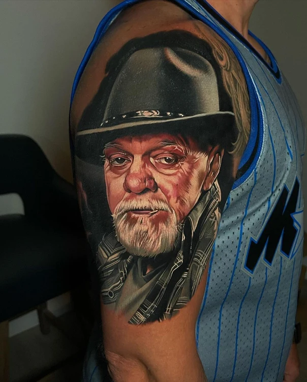 Realism Portrait tattoo on Upper Arm