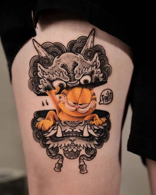 Illustrative Garfield, Demon mask tattoo on Thigh