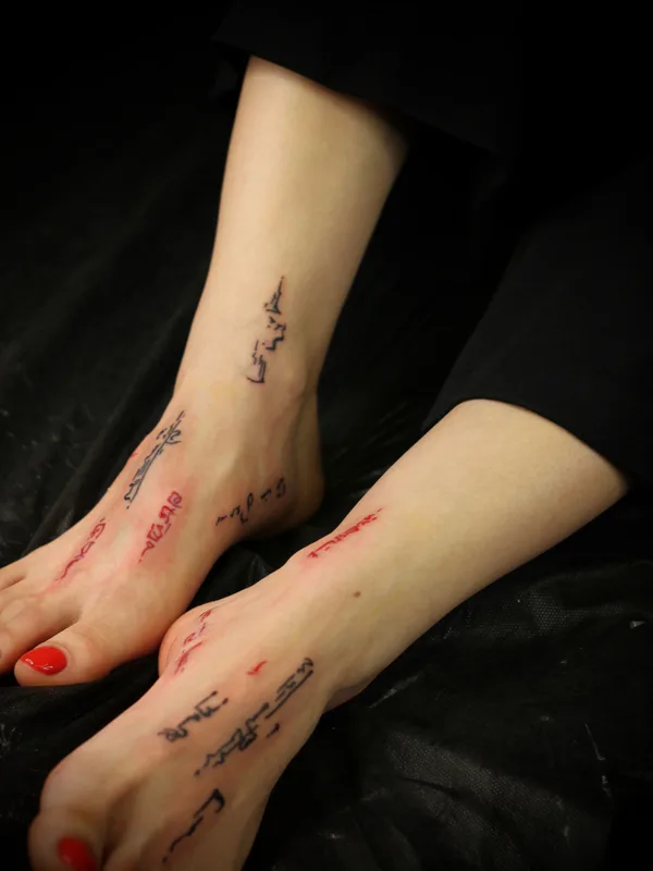 female black calligraphy Tatuagem em foot #76024 | Tatuador Иван Бакланов