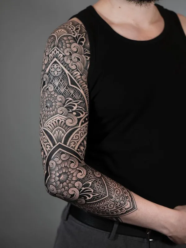 male black and grey ornamental tattoo on full sleeve #76207 | Tattoo Artist Dino De Cesare
