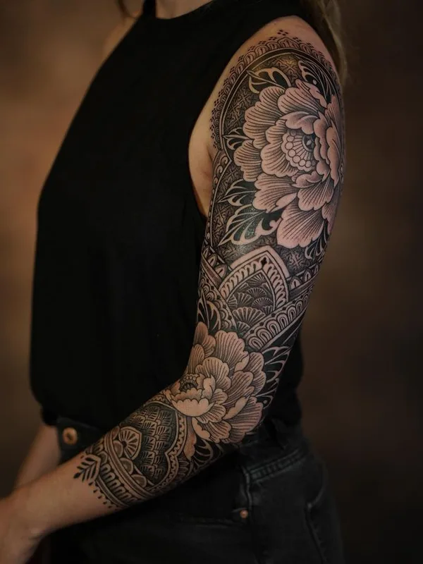 female black and grey blackwork tattoo on full sleeve #76210 | Tattoo Artist Dino De Cesare