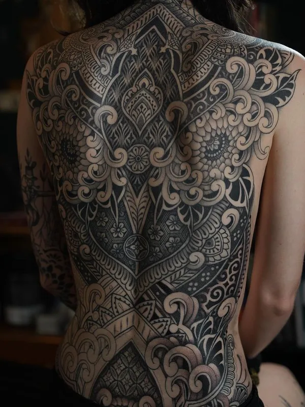 female black and grey ornamental tattoo on full back #76214 | Tattoo Artist Dino De Cesare
