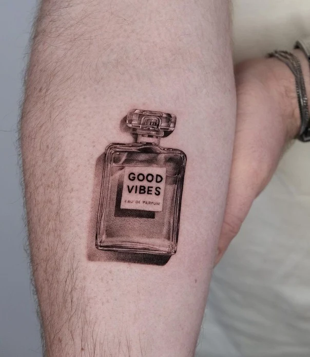Black & Grey Perfume bottle, Lettering tattoo on Forearm