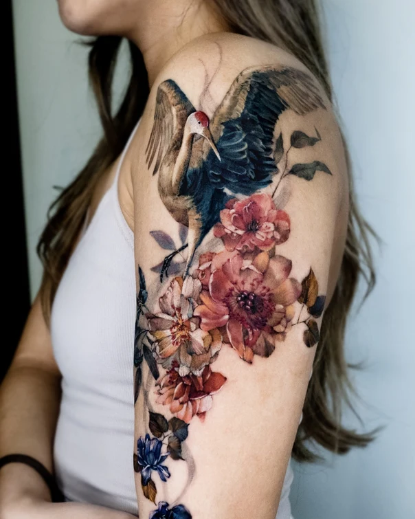 Illustrative Crane, Flowers tattoo on Shoulder