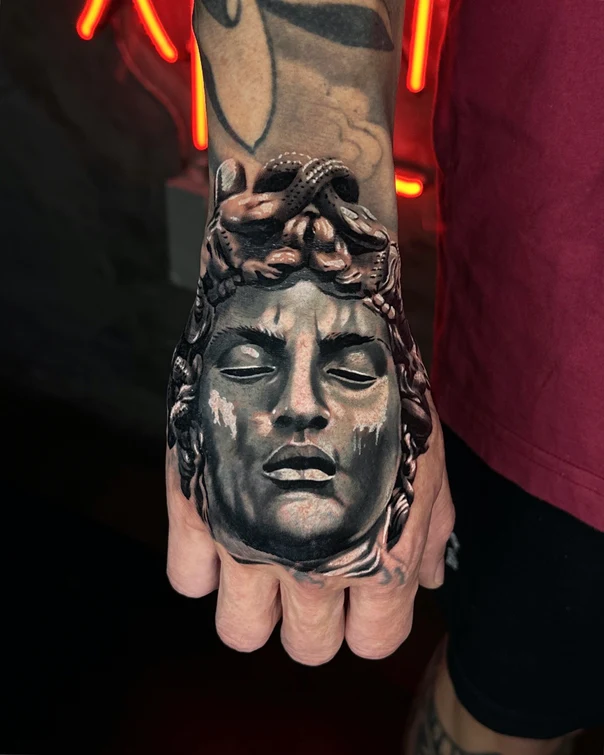 Realism Face, Statue tattoo on Back of Hand
