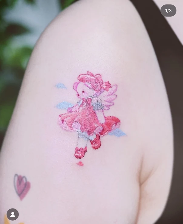 Illustrative Angel, Teddy bear tattoo on Shoulder