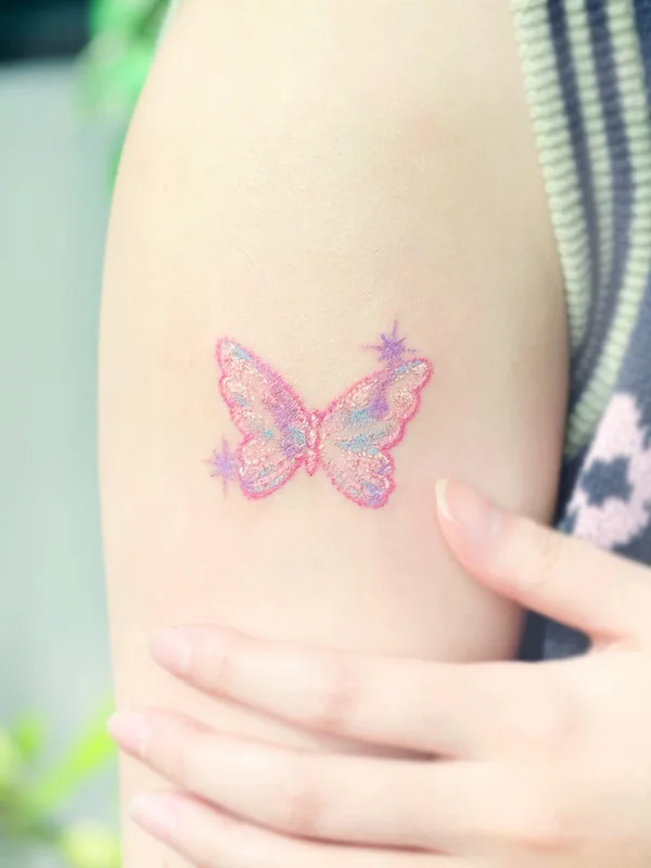 female color watercolor tattoo on upper arm #79994 | Tattoo Artist Haenal