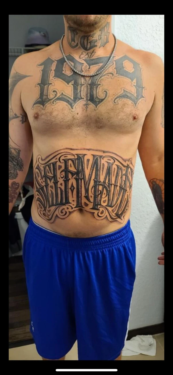 Lettering Lettering tattoo on Chest