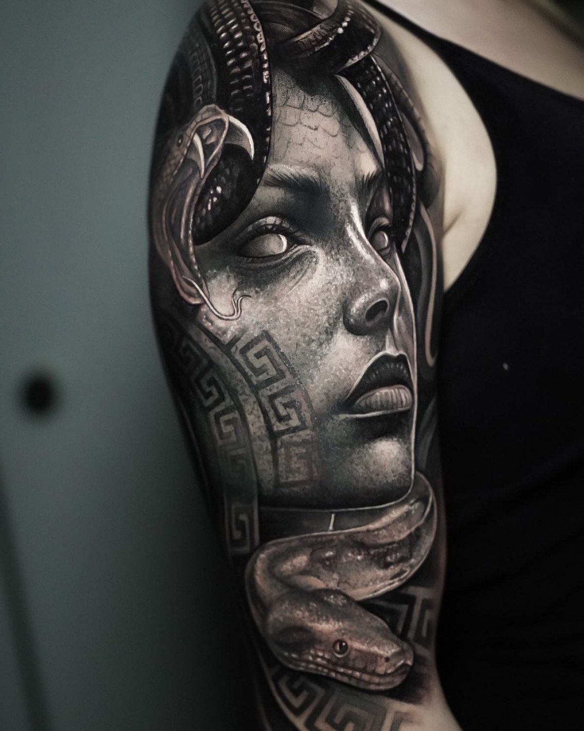 Black and grey realistic portrait of Meduse by Edi Contreras