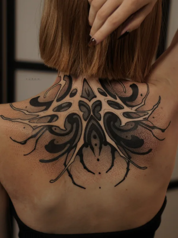 female black and grey blackwork tattoo on upper back #82200 | Tattoo Artist Юрий Черных