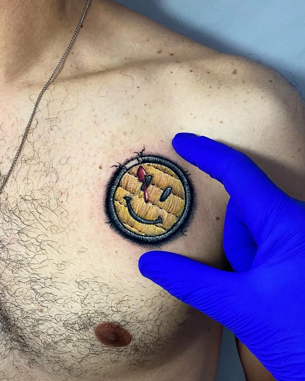 Illustrative Smiley face tattoo on Chest