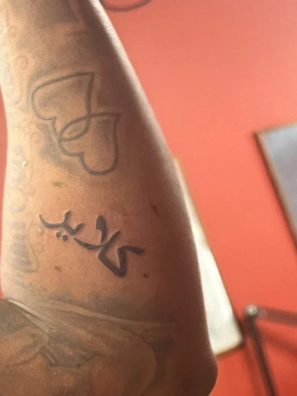 Lettering Hearts, Arabic script tattoo on Forearm
