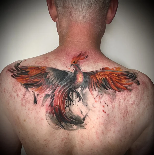 Illustrative Phoenix tattoo on Upper Back