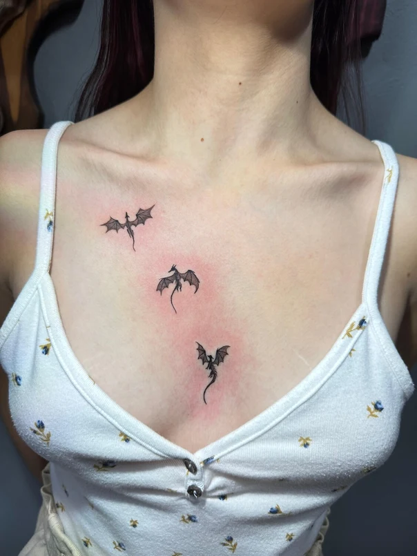 Fineline Dragon tattoo on Sternum