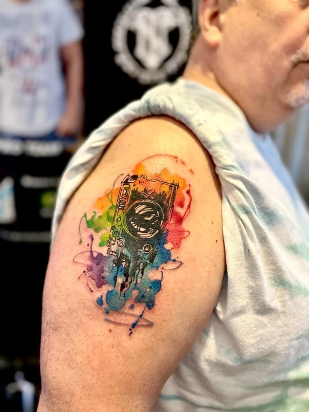 Watercolor Camera tattoo on Shoulder