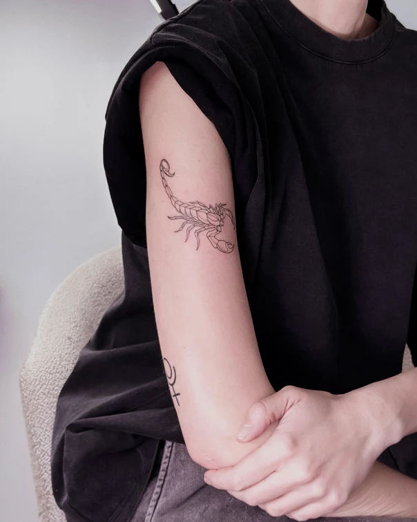 Linework Scorpion tattoo on Upper Arm