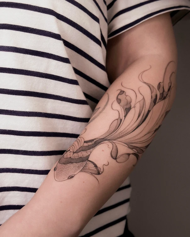 Fineline Fish tattoo on Forearm