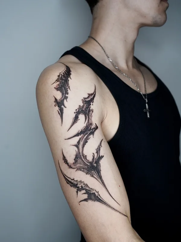 male black and grey blackwork tattoo on upper arm #95195 | Tattoo Artist Sol