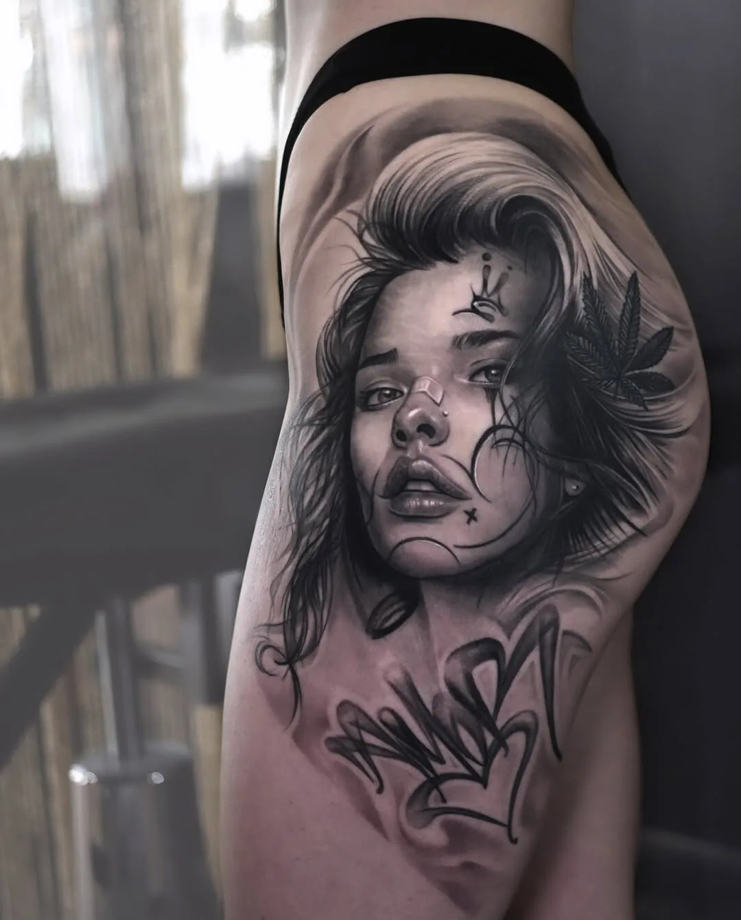 Realistic female portrait in gray tattoo tones