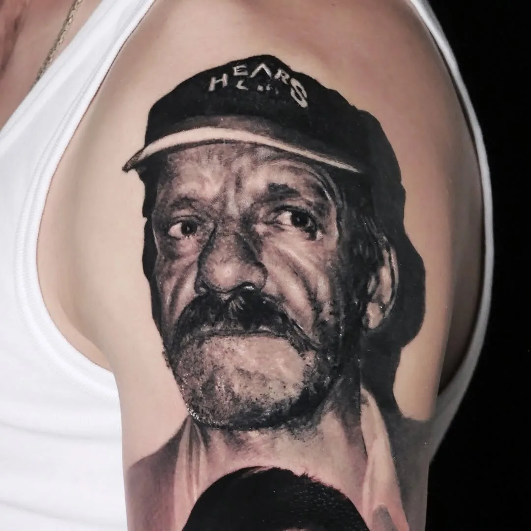 Black and gray male portrait tattoo