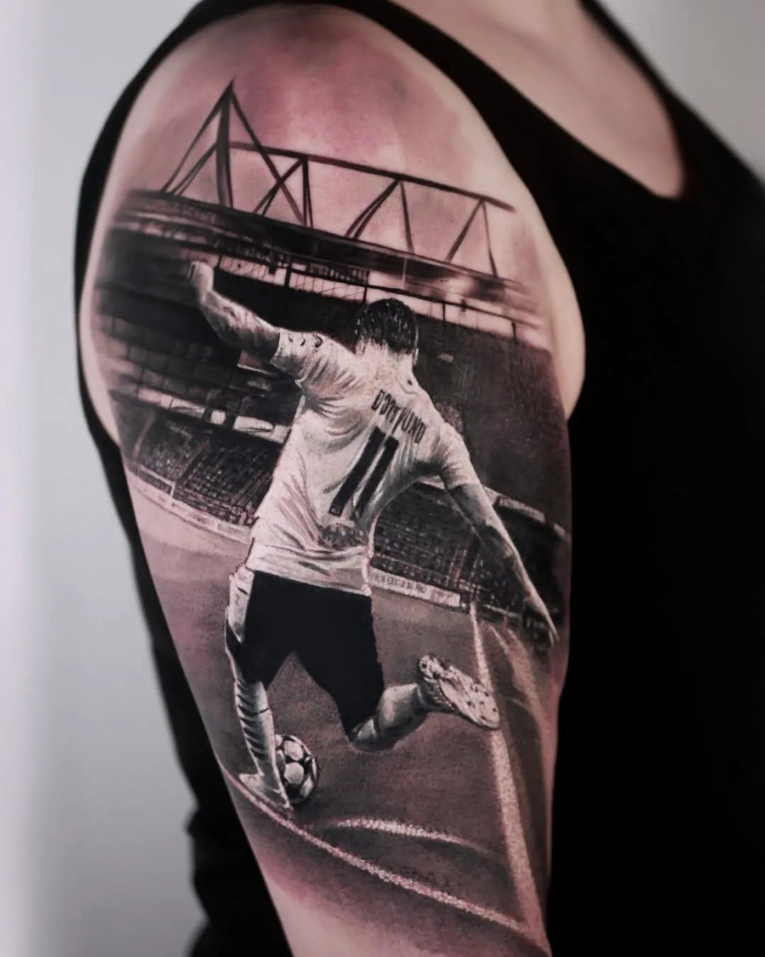 Realism tattoo: male portrait in gray tones