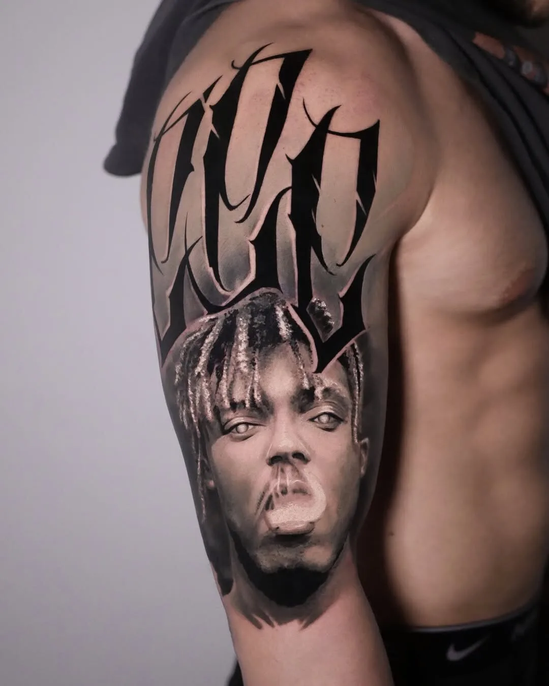 Black and gray portrait tattoo