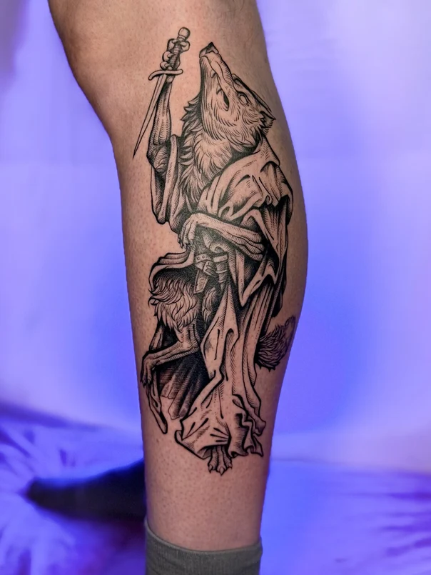 Engraving Wolf, Dagger tattoo on Calf
