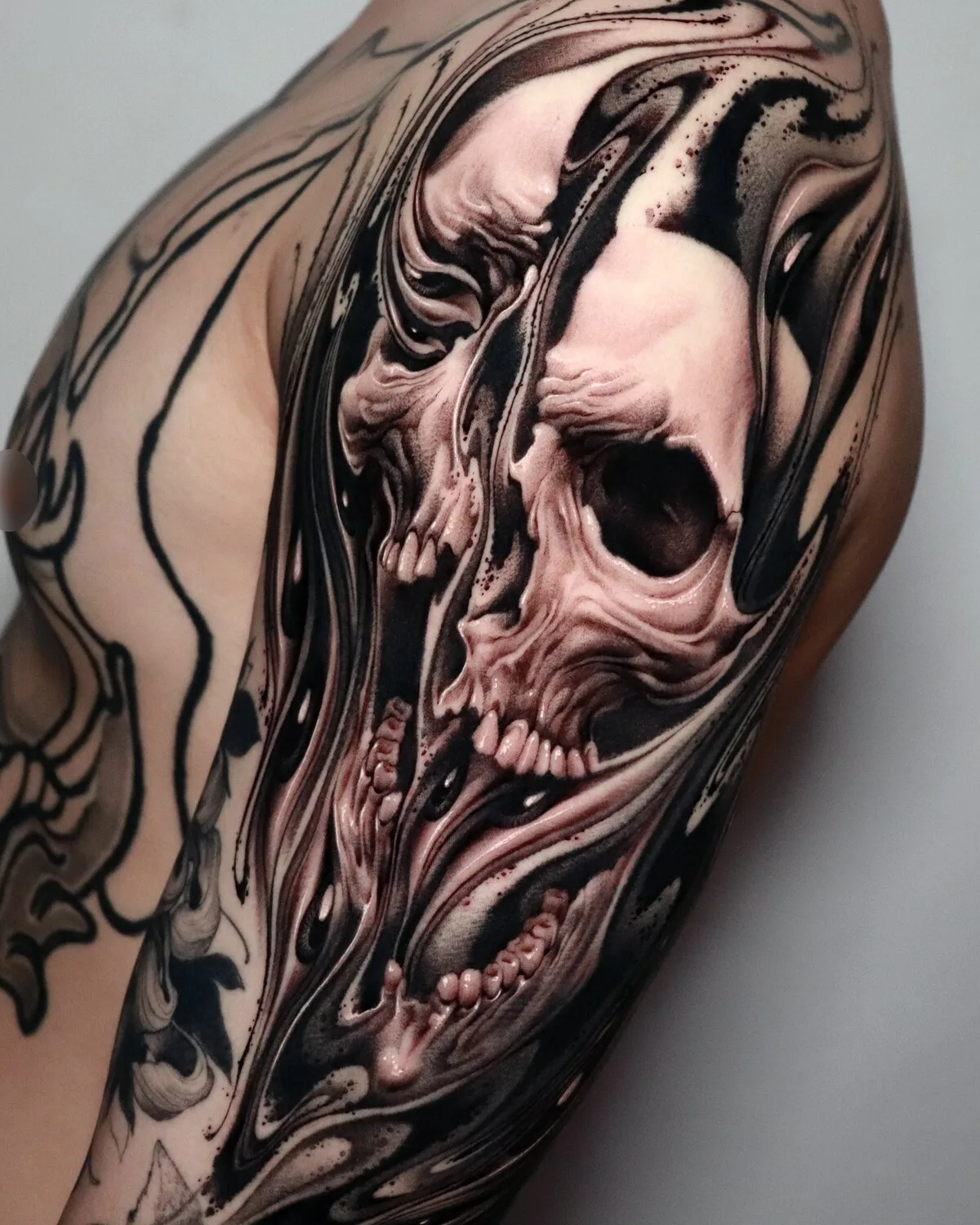 A highly detailed, realistic skull tattoo with dark surreal aesthetic, featuring intricate shading and swirling patterns throughout the cranium.