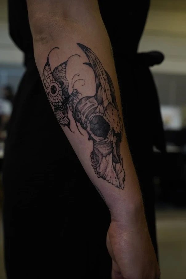 Blackwork Skull, Butterfly tattoo on Forearm