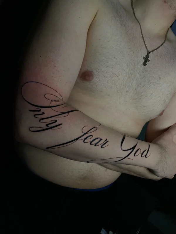 male black calligraphy 纹身 在 arm #104246 | 纹身师 Евгений Колодкин