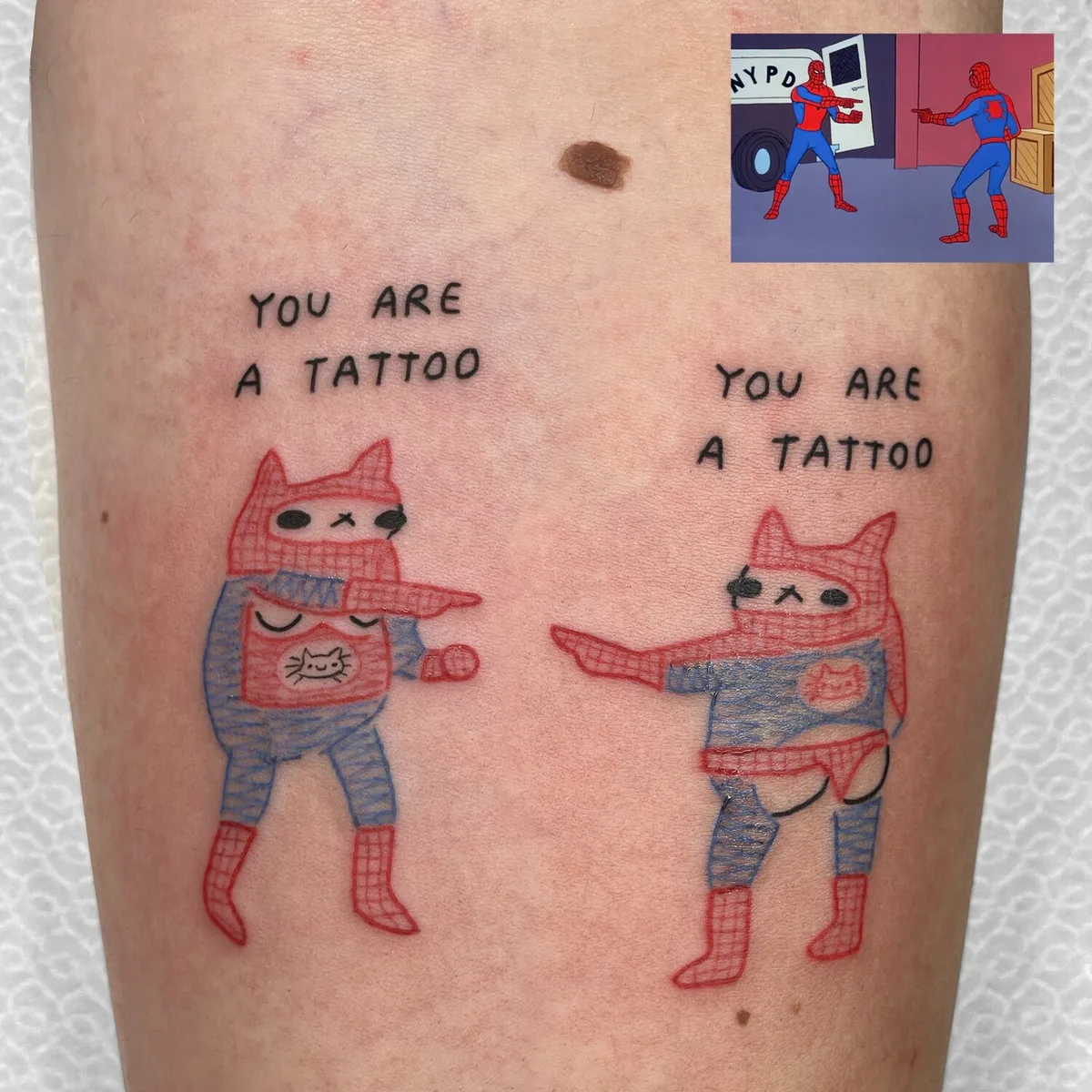 Cat George tattoo