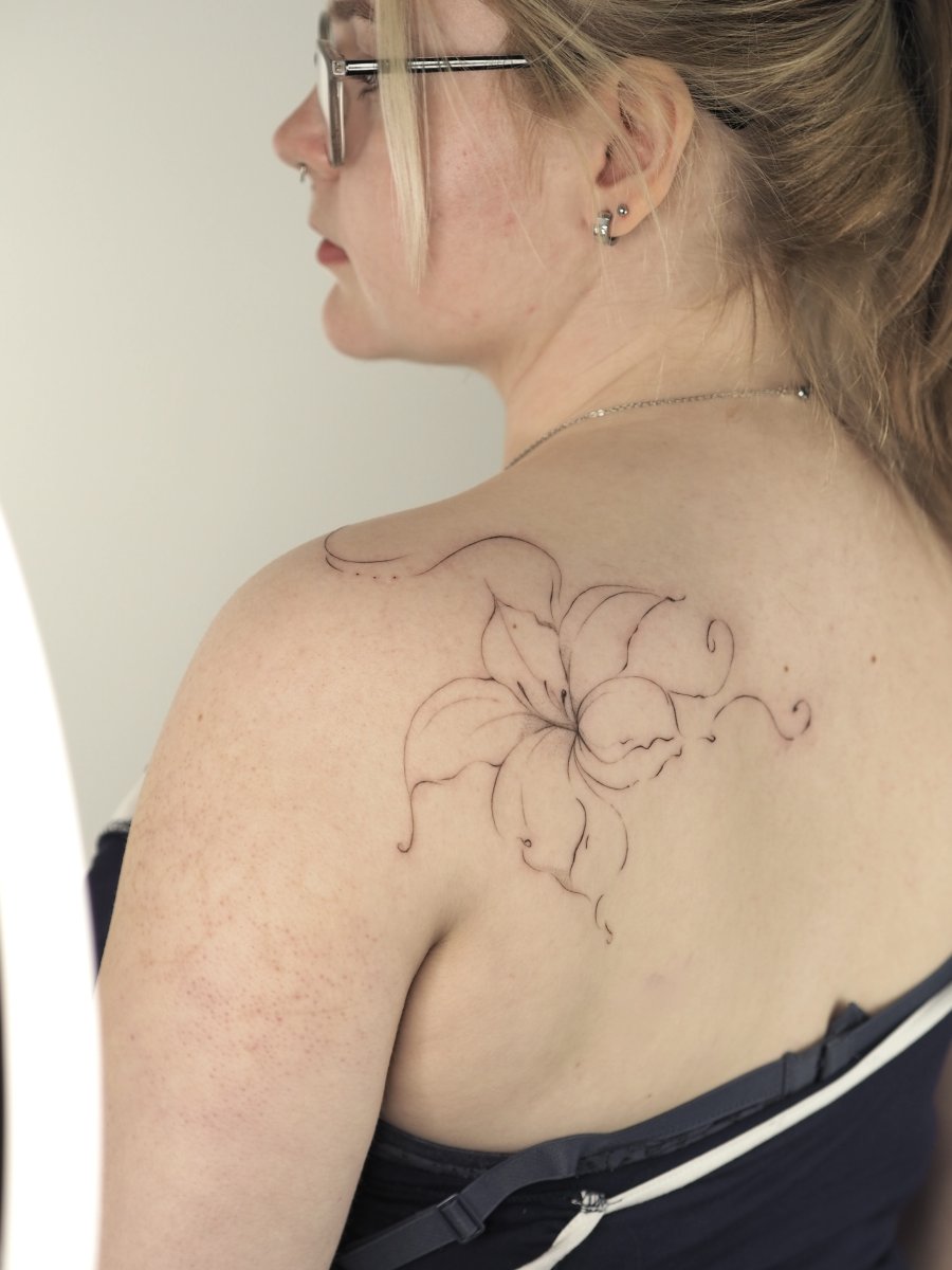 Fineline Lily, Flower tattoo on Upper Back