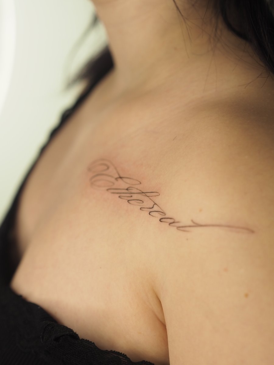 Lettering Script lettering, Word ethereal tattoo on Collarbone