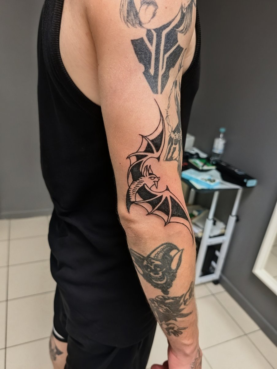 Blackwork Bat, Dragon tattoo on Upper Arm