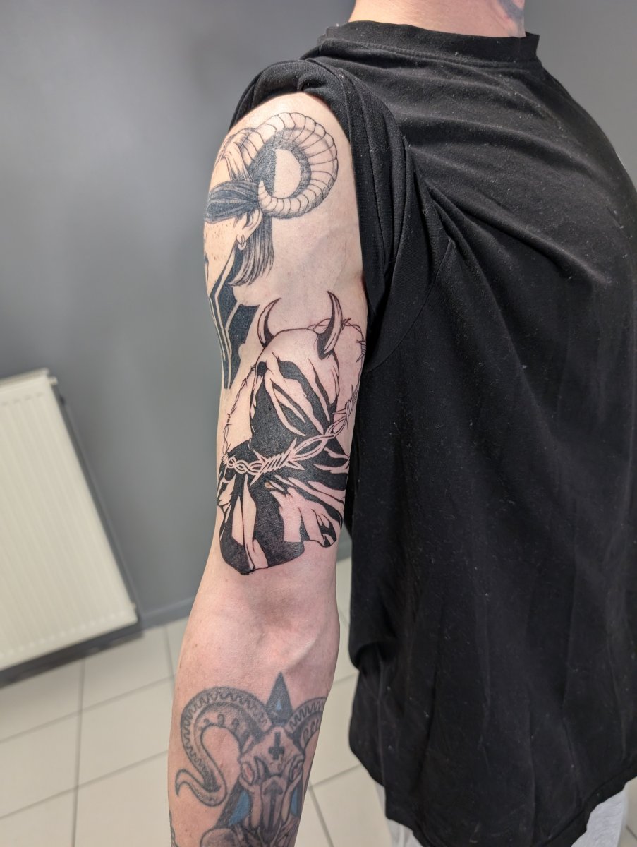 Anime Ram horns, Horned figure tattoo on Upper Arm